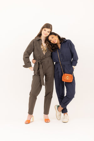 2 friends smiling wearing the Madeline Jumpsuit in olive and indigo by Le Mireille Marche.