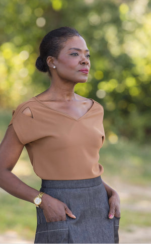 Elegant woman wearing Julie  double V top in French Roast/brown and Mireille two pocket denim skirt standing in a park in Paris by Le Mireille Marche.