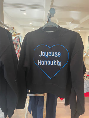 Black sweatshirt with Happy Hanukkah in French